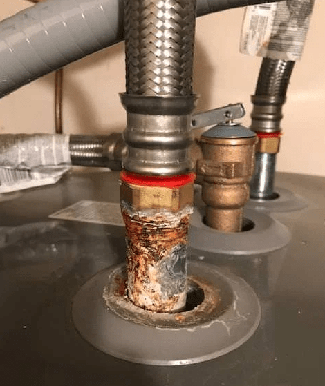 shown is galvanic corrosion on a water heater between two dissimilar metals during a home inspection with Barrie Inspections in Victoria Texas